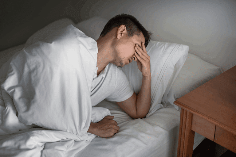 Man feeling unwell emphasizes Functional Medicine Solves Unexplained Symptoms